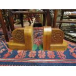 A pair of wooden bookends with carved floral detail, 17.