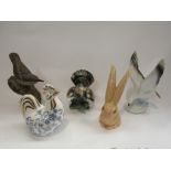 Five various ceramic and pottery figures including Poole,