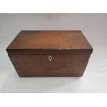 A Georgian oak tea caddy