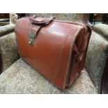 A vintage cow hide doctors bag