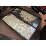 A 1930's Chinese bone Mahjong set with four stands and a bone set of games markers