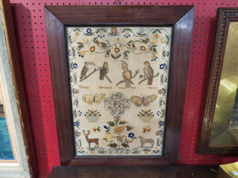 An early 19th Century sampler decorated with birds and animals with floral border Hannah Prince?