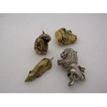 Four antique brass and silver plate collectable vesta cases, one silver plate lion, one brass lion,