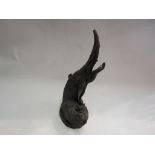 A diving otter figure,