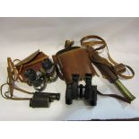 Two pairs of binoculars,