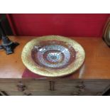 A mirrored and mosaic shallow bowl,