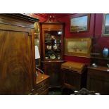 In the manner of "Maple & Co" an Edwardian inlaid mahogany full height corner cabinet,