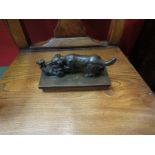 A late 19th Century bronze figure of hunting dog attacking a large cat,