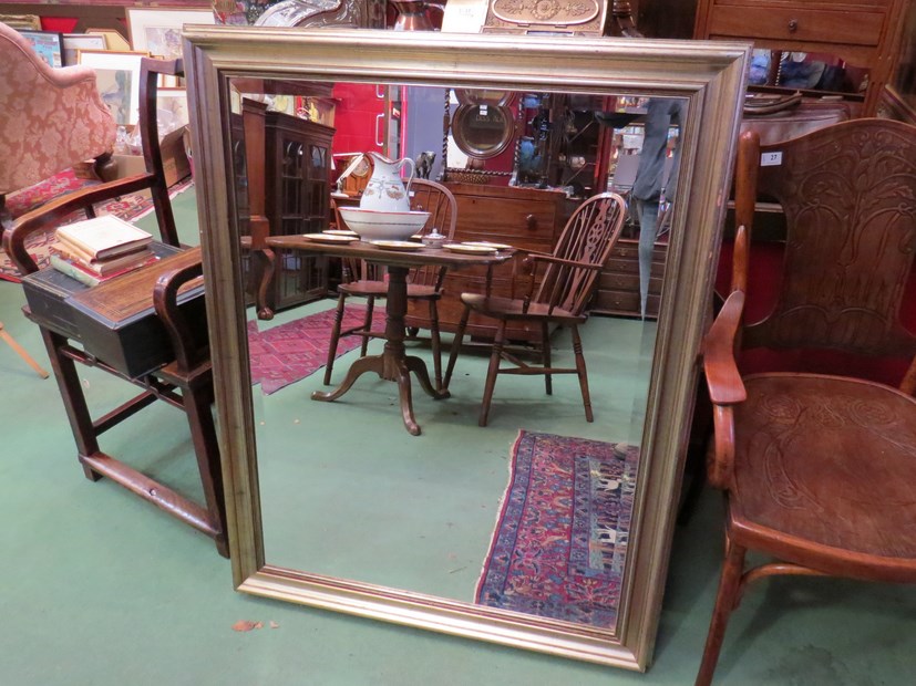 A brushed gilt wall mirror with bevelled glass, - Image 2 of 2