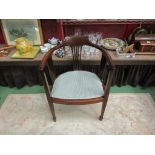 An Edwardian mahogany elbow chair the bow shape back with pierced splats having quatrefoil