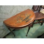 A chinoiserie painted demi-lune side table on pad foot cabriole legs,