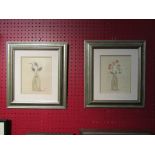 A pair of silver coloured framed still life images of flowers in jugs,