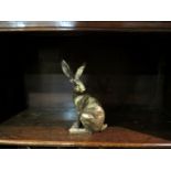 A seated hare figure,