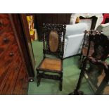 A Charles II walnut bergère chair with carved acanthus leaf and cherub decoration,