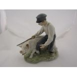 A Royal Copenhagen porcelain figural group of boy with pig, marked 848 to base,