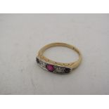 An 18ct gold Ruby and diamond ring. Size J/K, 2.