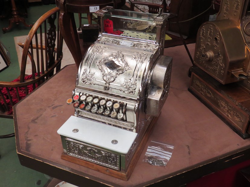 A National Cash Register, nickel plated case, model 348, serial no. 943030, made in 1911.