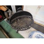 A cast iron fire basket
