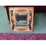 A painted framed wall mirror decorated with females and decorative motifs,