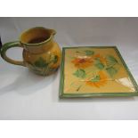 A French yellow and green floral design jug with matching dish