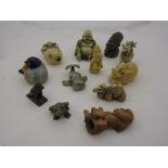 Twelve various figures including African head, Buddha,