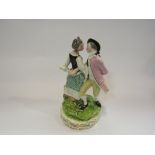 A 19th Century porcelain figure group of a couple dancing, in the Derby style, painted in colours,