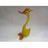 A Murano glass yellow duck figure with paper label,