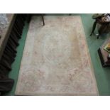 A beige ground floral design rug,