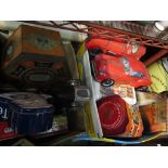 Two boxes containing bygone tins including cars,