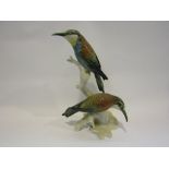 A Karl Ens figural group of two birds on branch,