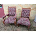 A pair of Victorian walnut his and hers armchairs,
