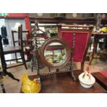 A late Victorian oak barley-twist tilting circular bevel edged dressing chest mirror,