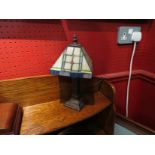 A small Tiffany style lamp