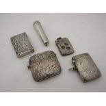 Four vesta cases including silver and a silver cheroot holder a/f
