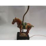 A Chinese Tang style horse lamp