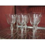 set of six Lalique stemmed water glasses, with leaf pattern to the four-sided stems.