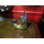 A brass and ceramic fish vase,