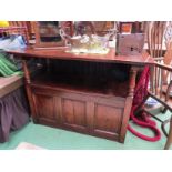 An 18th Century revival oak Monks bench the drop down table top over a hinged seat box seat settle