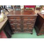 An early 18th Century oak chest of two short over three graduating long drawers with geometric