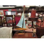 A Bowmans racing yacht made in Norfolk on stand,