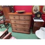 A Victorian mahogany chest of two over three drawers on squat bun feet, front faded,
