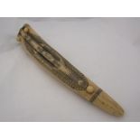 A reproduction scrimshaw cribbage board
