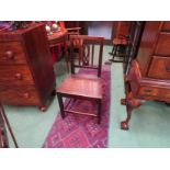Circa 1820 a pair of fruitwood chairs the fretwork central splat over a flat seat on square legs