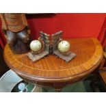 A pair of globe bookends