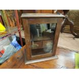 An early 20th Century oak smokers cabinet with two internal drawers