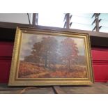 ANTHONY DUGDALE (XX): An ornate gilt framed oil on canvas of autumnal trees. Signed bottom left.
