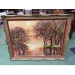 A naive oil of trees beside lake at sunset, ornate gilt framed,