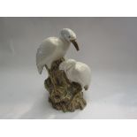 A ceramic figure of two cranes, beak a/f,