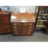 A George III flame mahogany bureau,