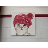 A canvas print of a cat wearing bobble hat,